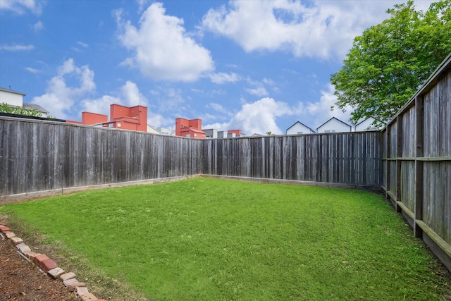 view of yard featuring a fenced backyard