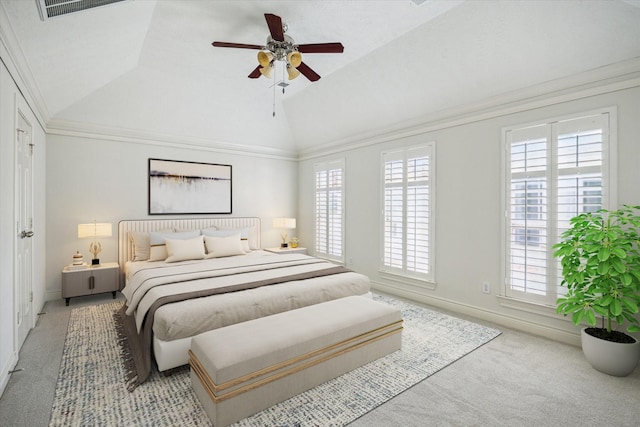 bedroom with multiple windows, vaulted ceiling, light colored carpet, and visible vents