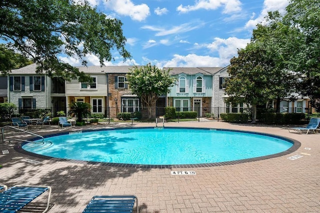 7463 Brompton St Unit 7463, Houston, TX 77025 - community pool with a patio area