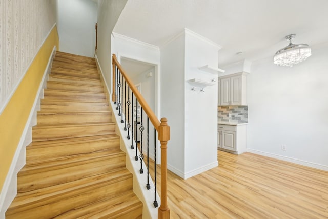 7463 Brompton St Unit 7463, Houston, TX 77025 - staircase featuring wood finished floors and ornamental molding