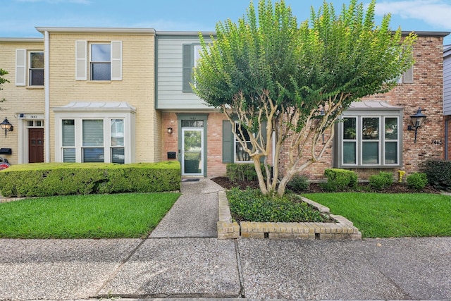 7463 Brompton St Unit 7463, Houston, TX 77025 - multi unit property with a front yard and brick siding