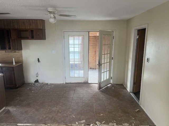 interior space with french doors, ceiling fan, and visible vents