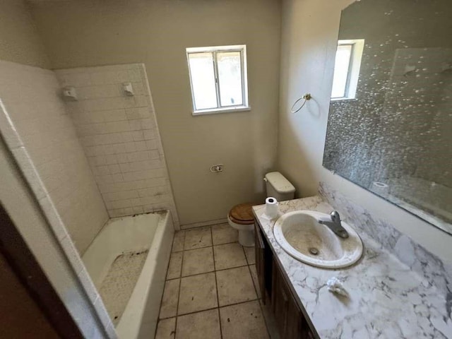 bathroom featuring toilet, tile patterned floors, and vanity