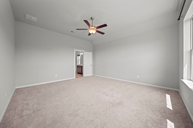 unfurnished bedroom featuring visible vents and light colored carpet