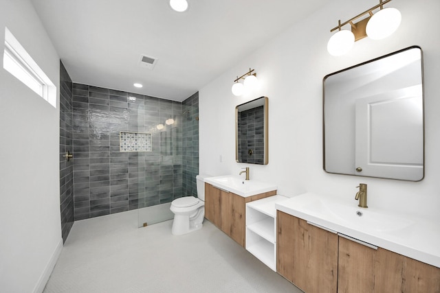 300 Narcissus Rd, Clear Lake Shores, TX 77565 - full bathroom featuring toilet, a walk in shower, two vanities, and a sink