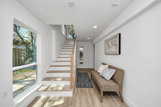 300 Narcissus Rd, Clear Lake Shores, TX 77565 - stairs featuring recessed lighting, wood finished floors, and a healthy amount of sunlight