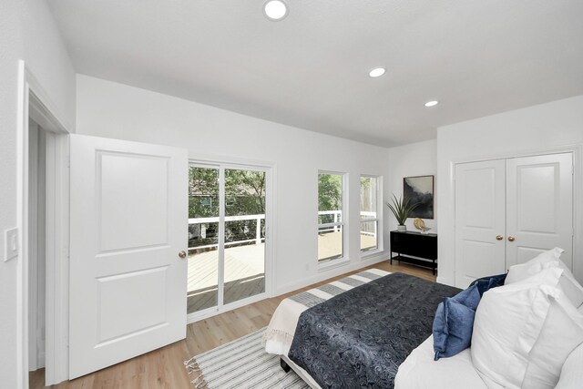 300 Narcissus Rd, Clear Lake Shores, TX 77565 - bedroom with a closet, baseboards, light wood-style floors, recessed lighting, and access to exterior