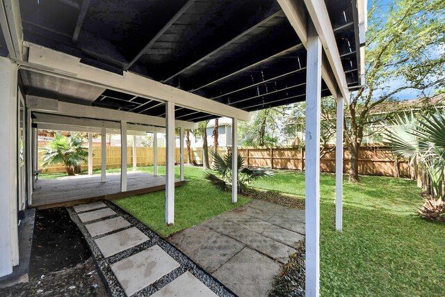 300 Narcissus Rd, Clear Lake Shores, TX 77565 - view of patio with a fenced backyard and a wooden deck