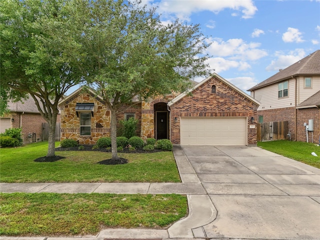321 Westwood Dr, League City, TX 77573 - view of front of home with an attached garage, concrete driveway, brick siding, and stone siding