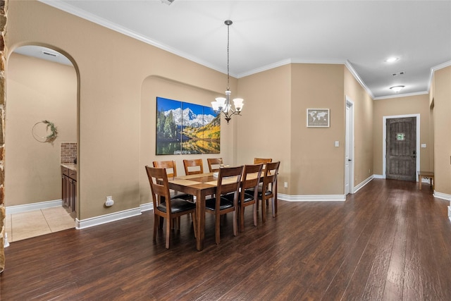 321 Westwood Dr, League City, TX 77573 - dining room featuring wood finished floors, ornamental molding, baseboards, arched walkways, and recessed lighting