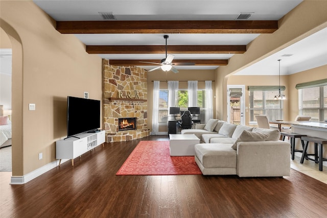 321 Westwood Dr, League City, TX 77573 - living room featuring arched walkways, a ceiling fan, healthy amount of natural light, wood finished floors, and beamed ceiling