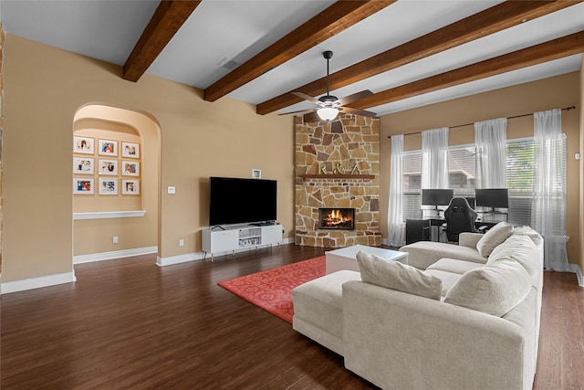 321 Westwood Dr, League City, TX 77573 - living area with a fireplace, dark wood finished floors, beamed ceiling, a ceiling fan, and baseboards
