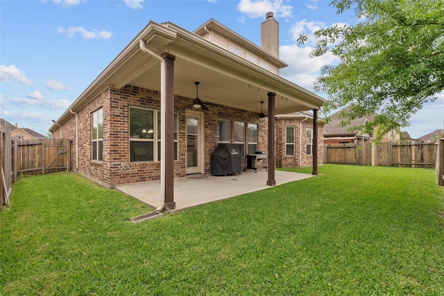 321 Westwood Dr, League City, TX 77573 - rear view of house with ceiling fan, brick siding, a chimney, and a patio