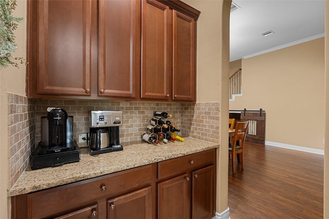 321 Westwood Dr, League City, TX 77573 - kitchen featuring ornamental molding, backsplash, dark wood-style flooring, baseboards, and light stone counters