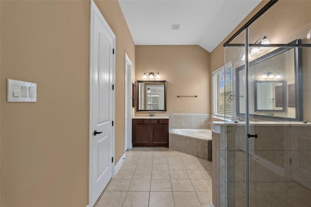 321 Westwood Dr, League City, TX 77573 - full bathroom with a garden tub, a stall shower, tile patterned floors, vanity, and lofted ceiling