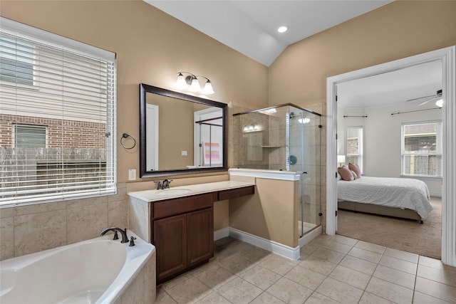 321 Westwood Dr, League City, TX 77573 - ensuite bathroom featuring tile patterned floors, a stall shower, a garden tub, lofted ceiling, and vanity