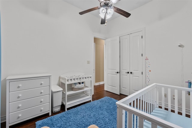 321 Westwood Dr, League City, TX 77573 - bedroom with a closet, wood finished floors, a crib, and a ceiling fan