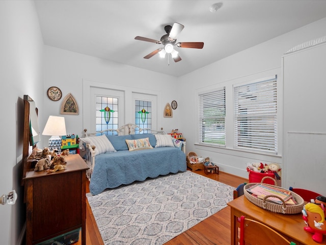 824 Sledge St, Houston, TX 77009 - bedroom with wood finished floors and a ceiling fan