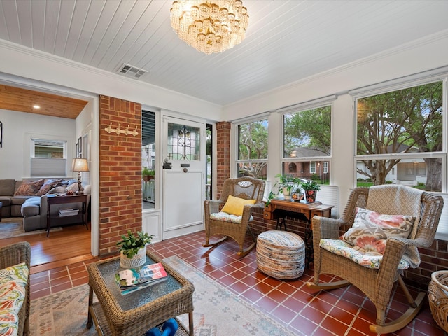 824 Sledge St, Houston, TX 77009 - sunroom / solarium with tile patterned flooring, a chandelier, and crown molding