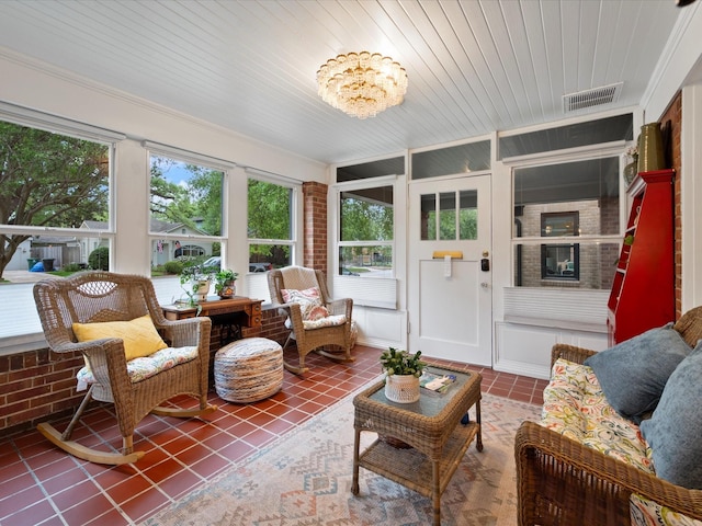 824 Sledge St, Houston, TX 77009 - sunroom featuring tile patterned flooring and crown molding