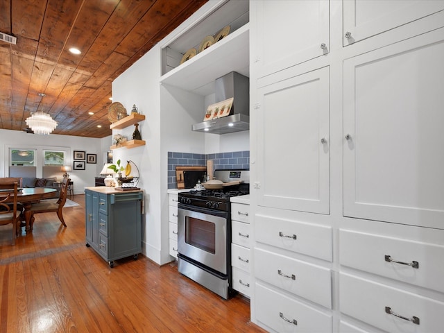 824 Sledge St, Houston, TX 77009 - kitchen featuring stainless steel range with gas stovetop, open shelves, wall chimney exhaust hood, wooden ceiling, and hardwood / wood-style floors