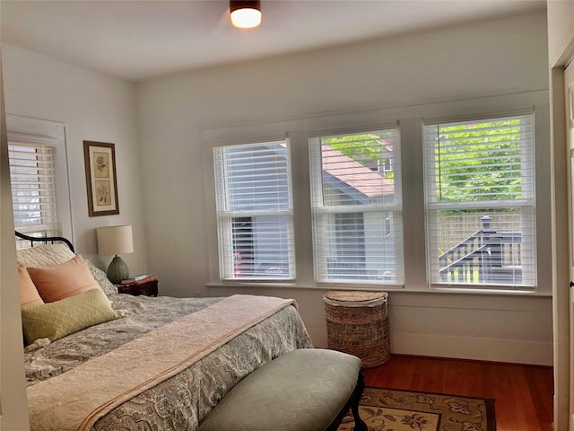 824 Sledge St, Houston, TX 77009 - bedroom with wood finished floors and multiple windows