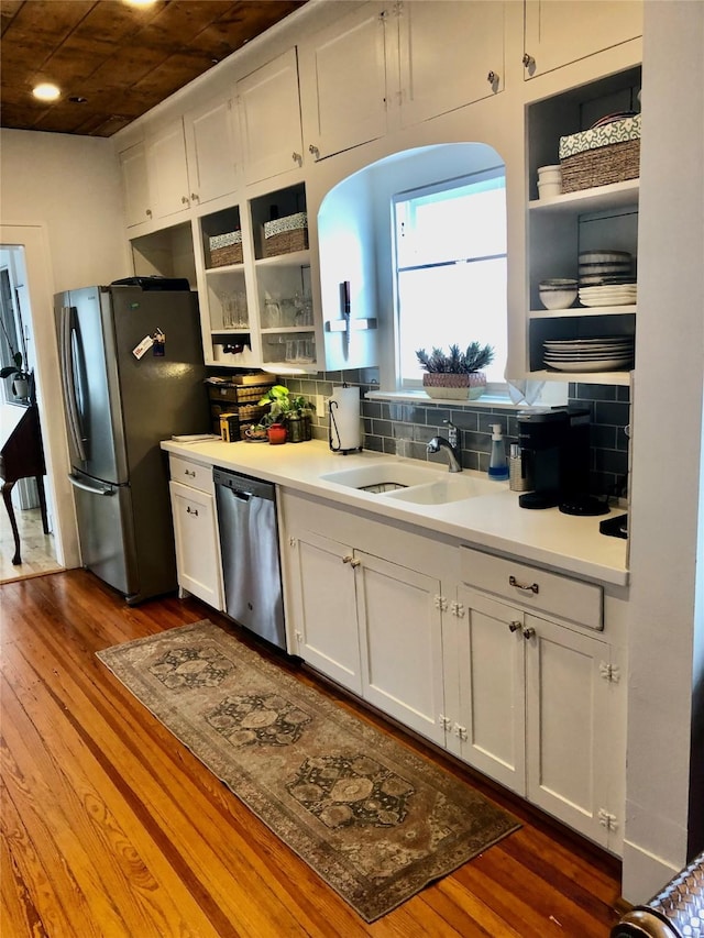 824 Sledge St, Houston, TX 77009 - kitchen with stainless steel appliances, open shelves, a sink, dark wood-style floors, and recessed lighting