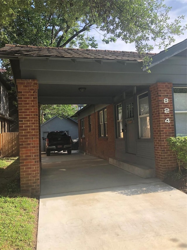 824 Sledge St, Houston, TX 77009 - view of car parking with driveway, an attached carport, and fence