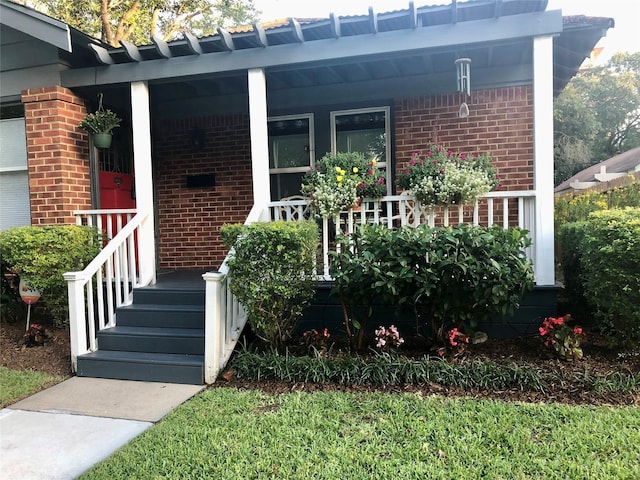824 Sledge St, Houston, TX 77009 - view of exterior entry with brick siding and covered porch