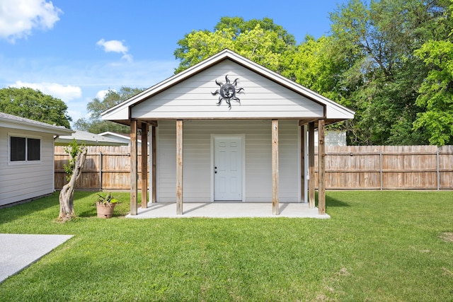 view of outbuilding featuring an outbuilding and fence