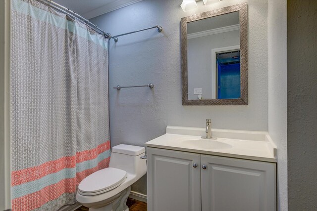 3535 Nasa Rd 1St Pkwy, Unit 36, Seabrook, TX 77586 - full bathroom featuring curtained shower, ornamental molding, toilet, a textured wall, and vanity