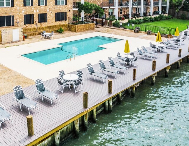 3535 Nasa Rd 1St Pkwy, Unit 36, Seabrook, TX 77586 - view of pool with fence and a water view