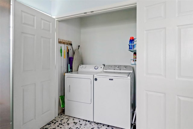 laundry area with laundry area and washing machine and clothes dryer