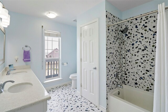 13213 Gulf Beach Dr, Freeport, TX 77541 - bathroom with a sink, shower / bath combo with shower curtain, toilet, and double vanity