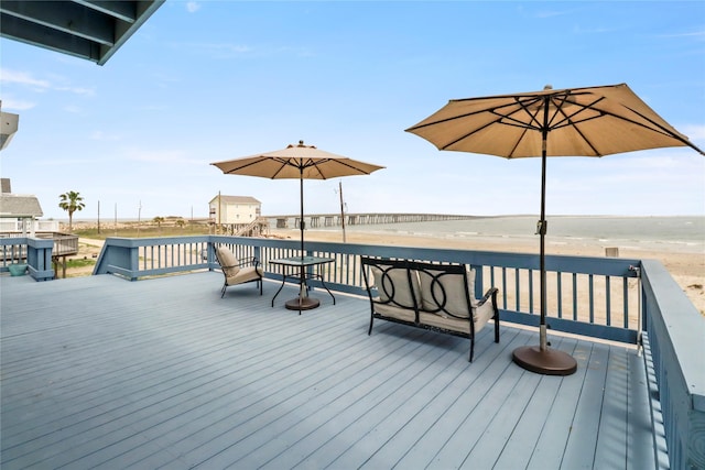 wooden deck featuring a water view
