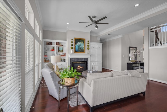 living area featuring wood finished floors, a ceiling fan, and recessed lighting