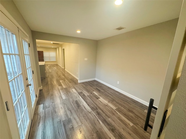 3060 Noble St, Houston, TX 77026 - unfurnished room with french doors, dark wood-style flooring, baseboards, and visible vents