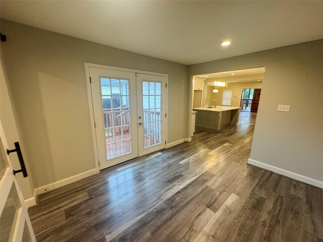 3060 Noble St, Houston, TX 77026 - interior space featuring dark wood-style flooring, recessed lighting, french doors, and baseboards