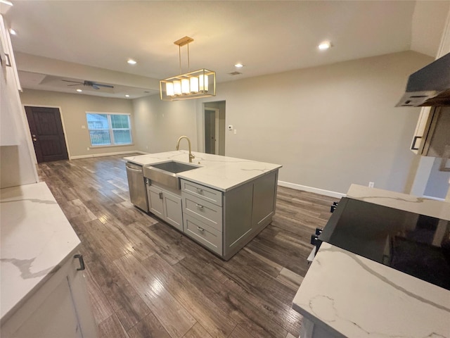 3060 Noble St, Houston, TX 77026 - kitchen featuring a sink, gray cabinets, light stone counters, and dark wood-style floors