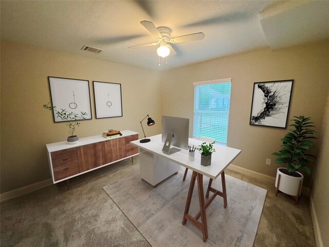 3060 Noble St, Houston, TX 77026 - office area featuring visible vents, baseboards, a ceiling fan, and carpet floors