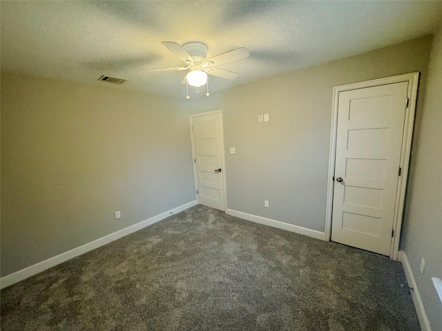 3060 Noble St, Houston, TX 77026 - spare room featuring visible vents, ceiling fan, carpet, and a textured ceiling