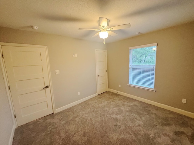 3060 Noble St, Houston, TX 77026 - carpeted spare room featuring baseboards and a ceiling fan