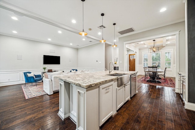 1411 Overhill St, Houston, TX 77018 - kitchen featuring a sink, crown molding, visible vents, a decorative wall, and dark wood-type flooring