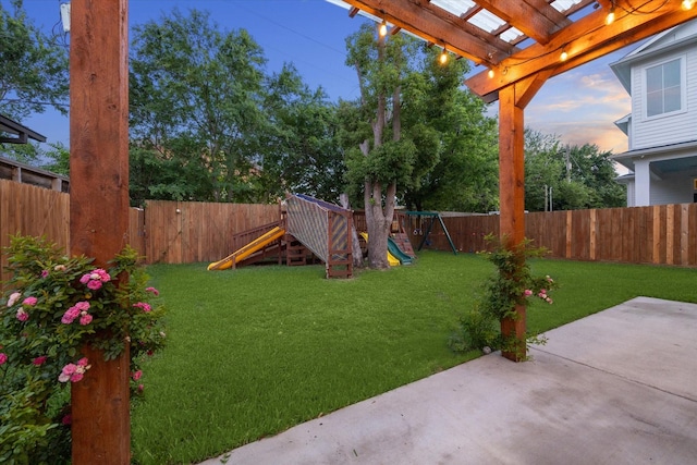 1411 Overhill St, Houston, TX 77018 - yard at dusk featuring a patio, a fenced backyard, a pergola, and a playground