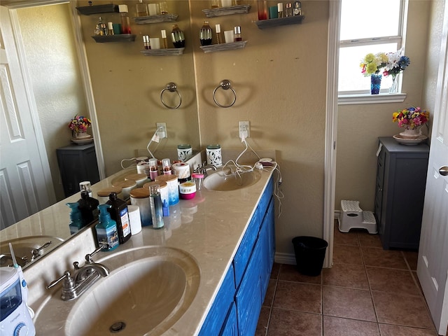 301 Hedy Dr, Killeen, TX 76542 - bathroom with double vanity, tile patterned flooring, and a sink