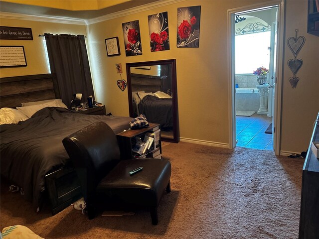 301 Hedy Dr, Killeen, TX 76542 - carpeted bedroom with crown molding, baseboards, and ensuite bathroom