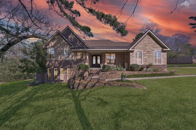 11445 Majestic Dr, Montgomery, TX 77316 - view of front of house with covered porch, stone siding, fence, and a front yard