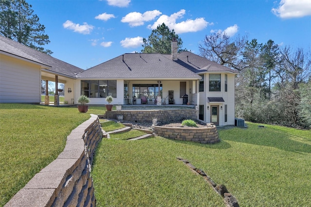11445 Majestic Dr, Montgomery, TX 77316 - back of house featuring central air condition unit, a chimney, a yard, and a patio area