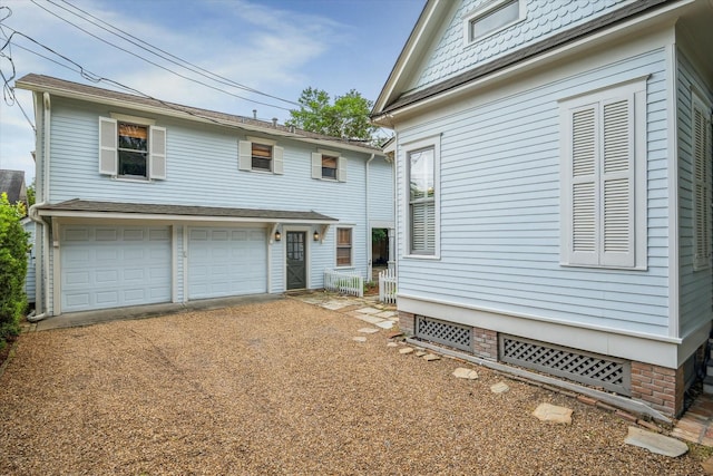 view of front of property featuring an attached garage and driveway