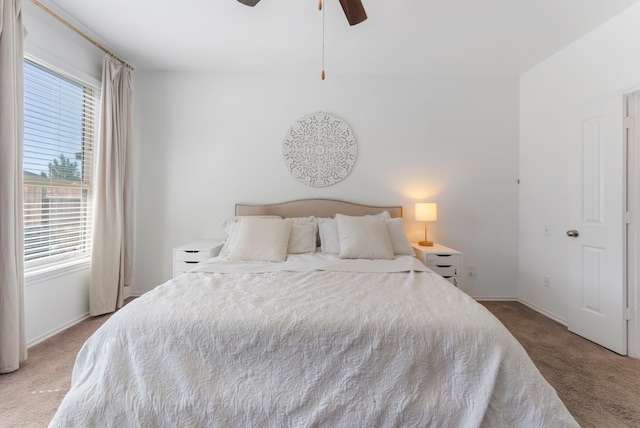 23830 Via Leoni Dr, New Caney, TX 77357 - carpeted bedroom with multiple windows, baseboards, and ceiling fan